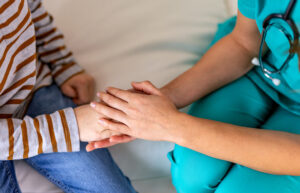nurse comforting child